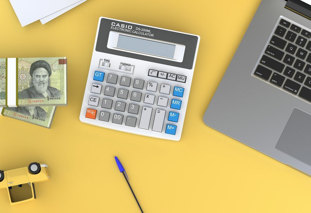 Calculator and laptop on a desk, illustrating Google Ads cost and budget planning for Mississauga businesses